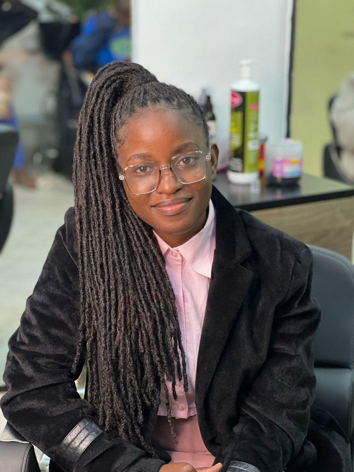 Bella — Owner and Locs Artist